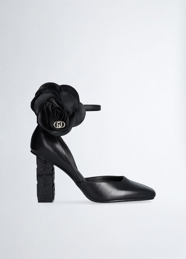 D&eacute;collet&eacute; in pelle con fiore