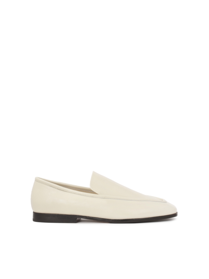 White leather loafers with black sole