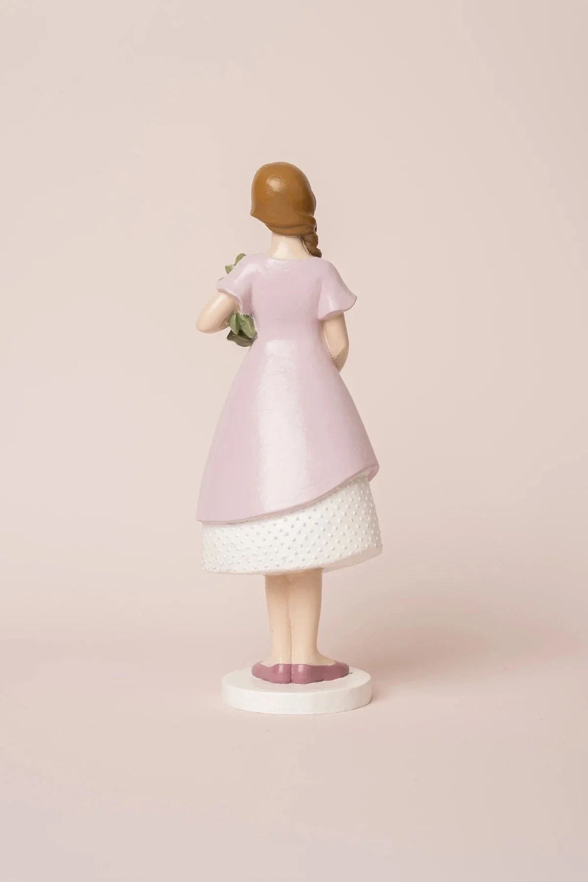 Decorative Girl in Pink Dress Holding Flowers