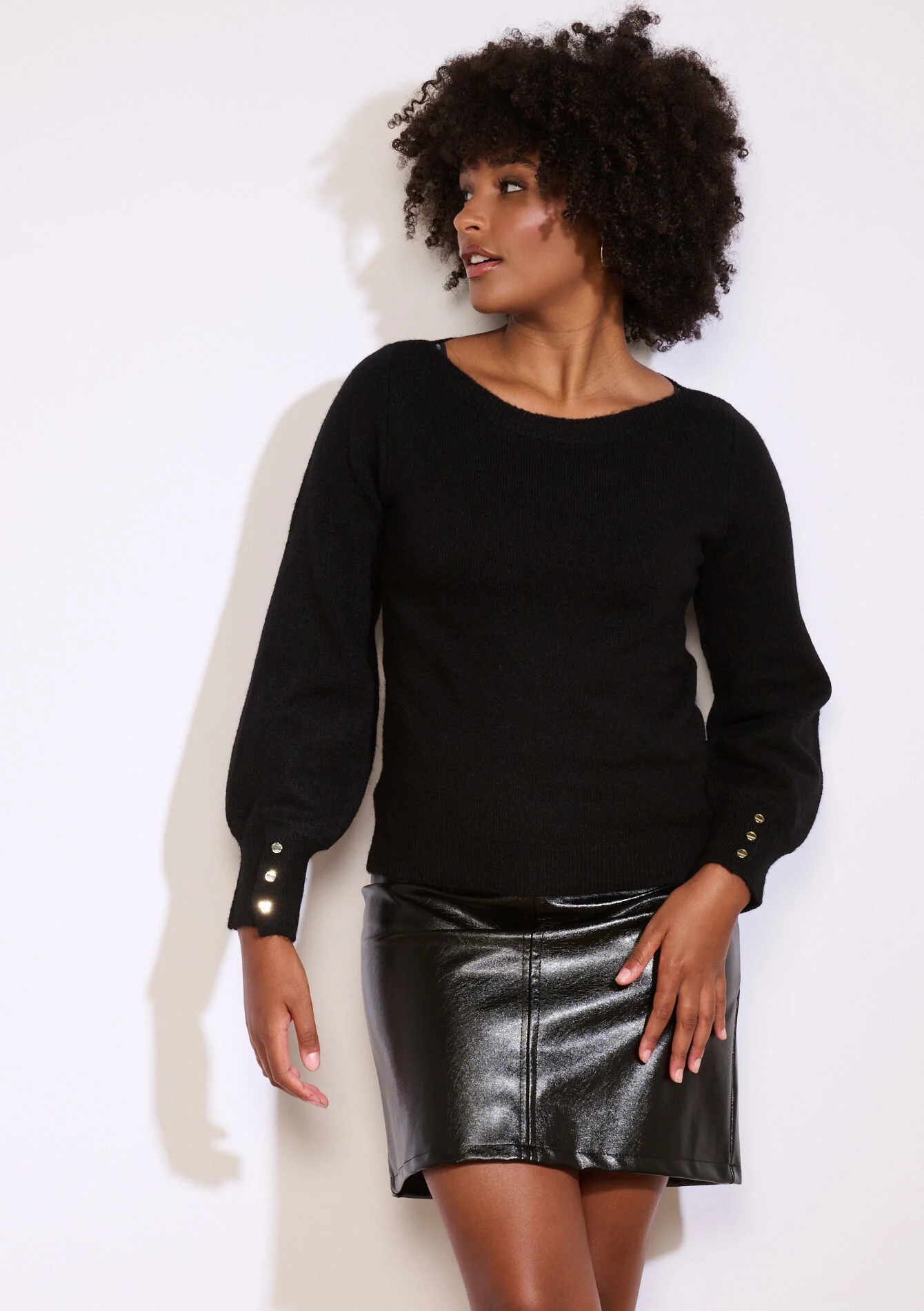 Trui met knopen op mouw