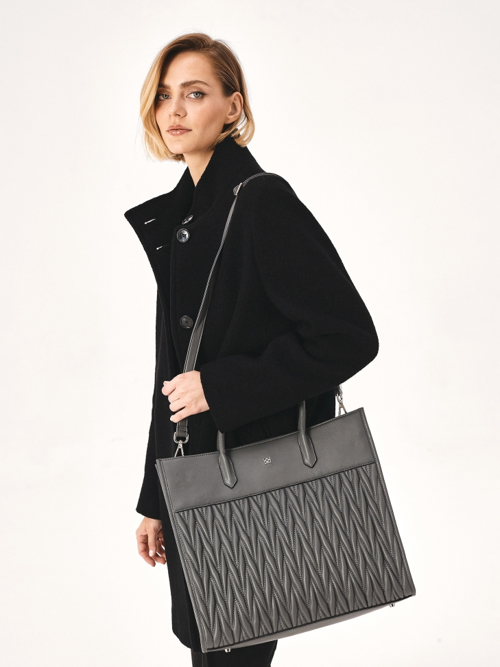 Large gray handbag with handles and quilted body