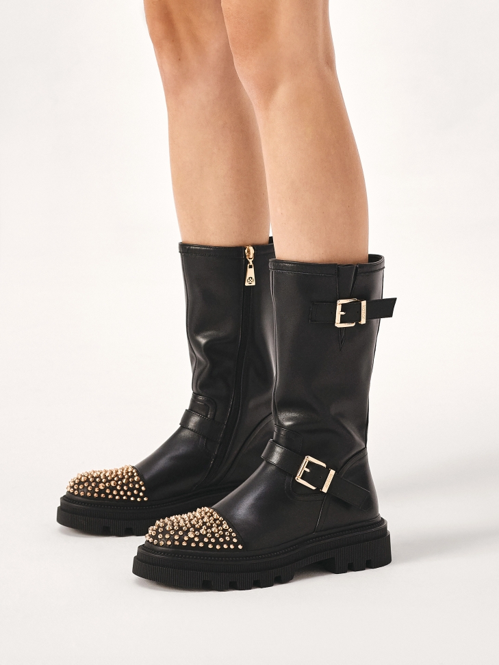 Boots on a thick sole decorated with rhinestones