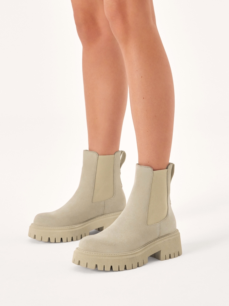 Slip-on boots on a trefoil sole