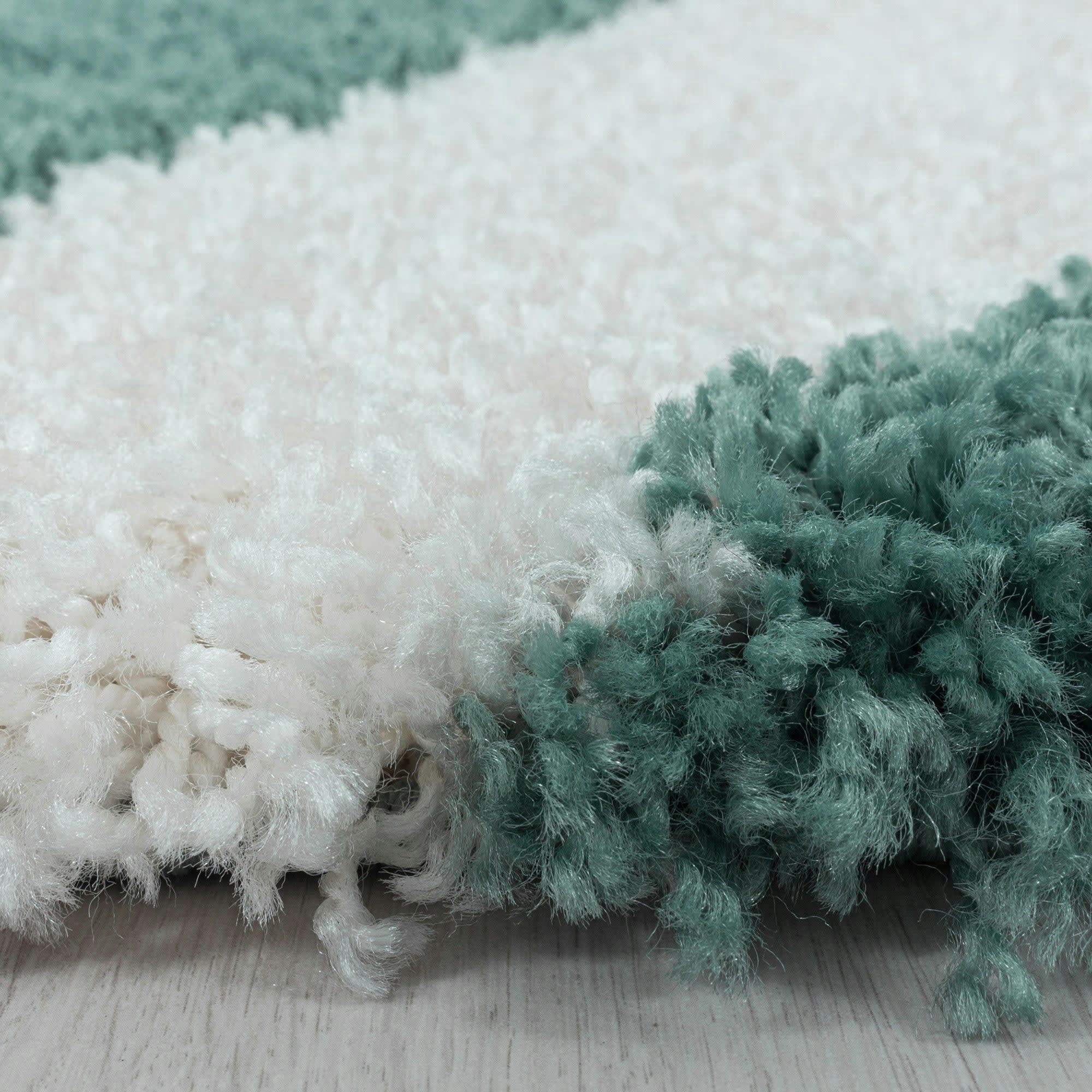 TRIANGLE - Tapis rond à poils longs géométrique turquoise et blanc 200x200cm