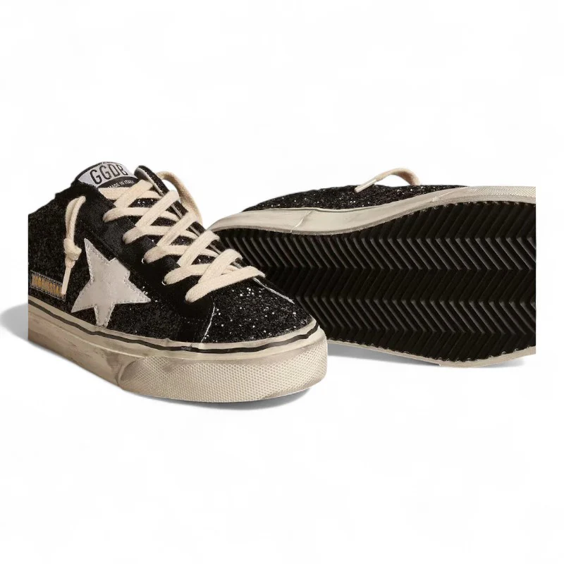 Super-Star Sabots in black glitter with a white bio-based star detail