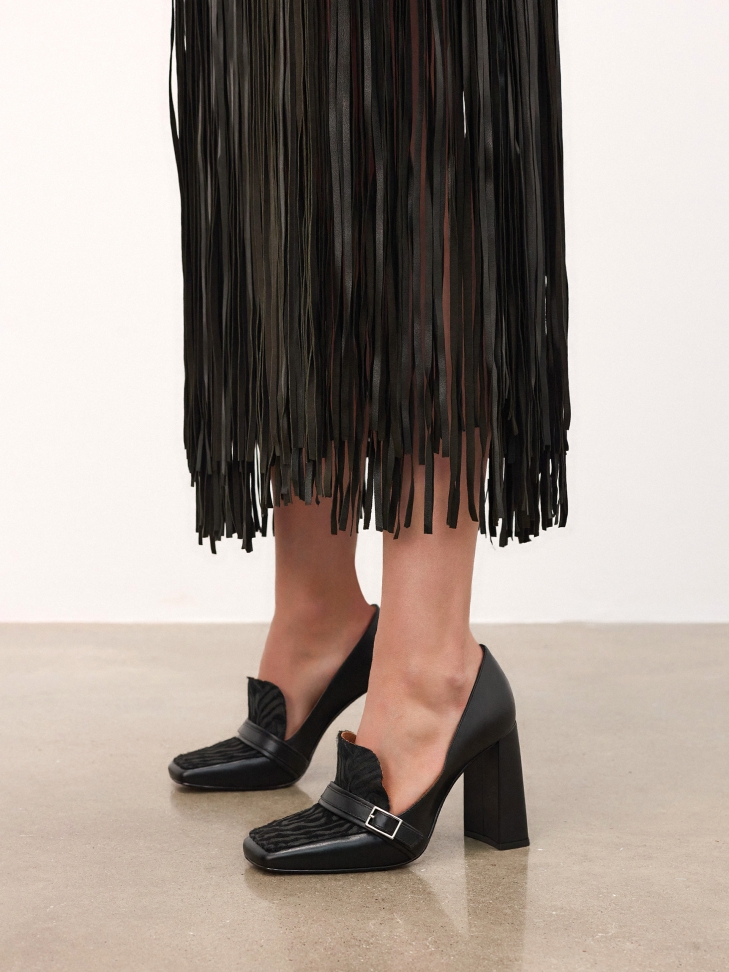 Black stiletto pumps with animal print accents