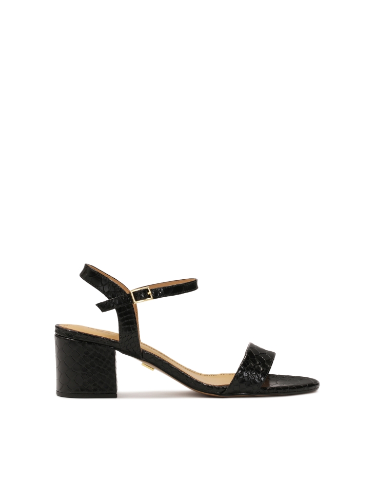 Embossed leather sandals on a wide post