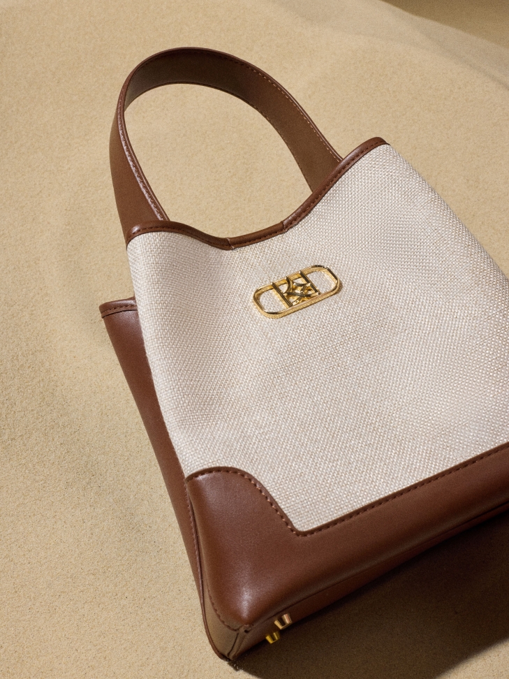 Brown leather handbag with fabric insert