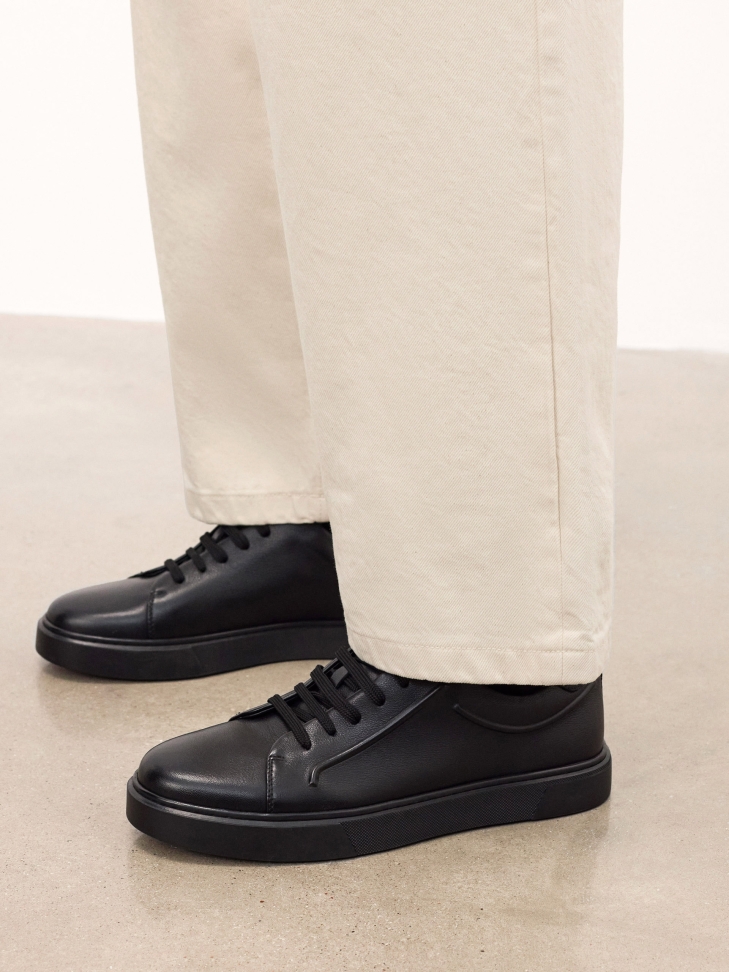 Black embossed sneakers