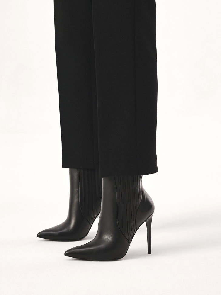 Minimalist boots on a slender stiletto heel