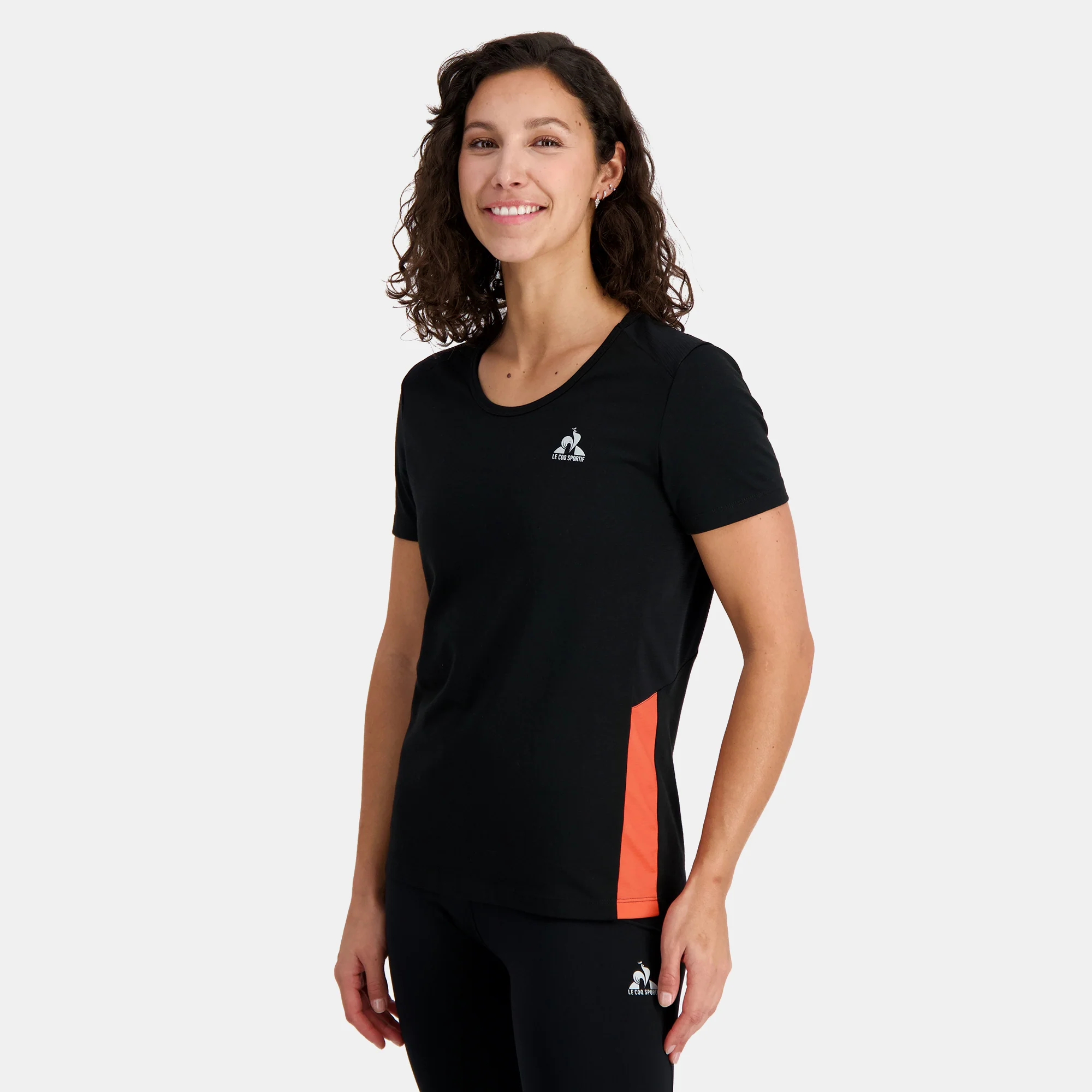 2410233-TRAINING Tee SS N°1 W black/orange perf | T-shirt Femme