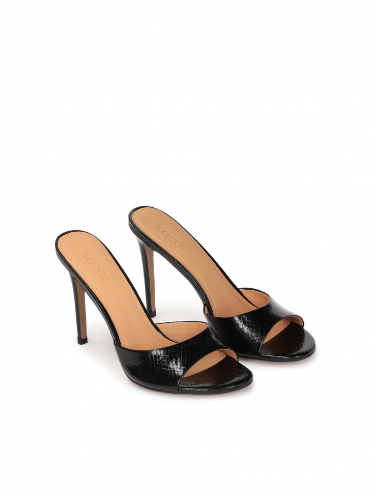 Black mules on a heel made of embossed leather