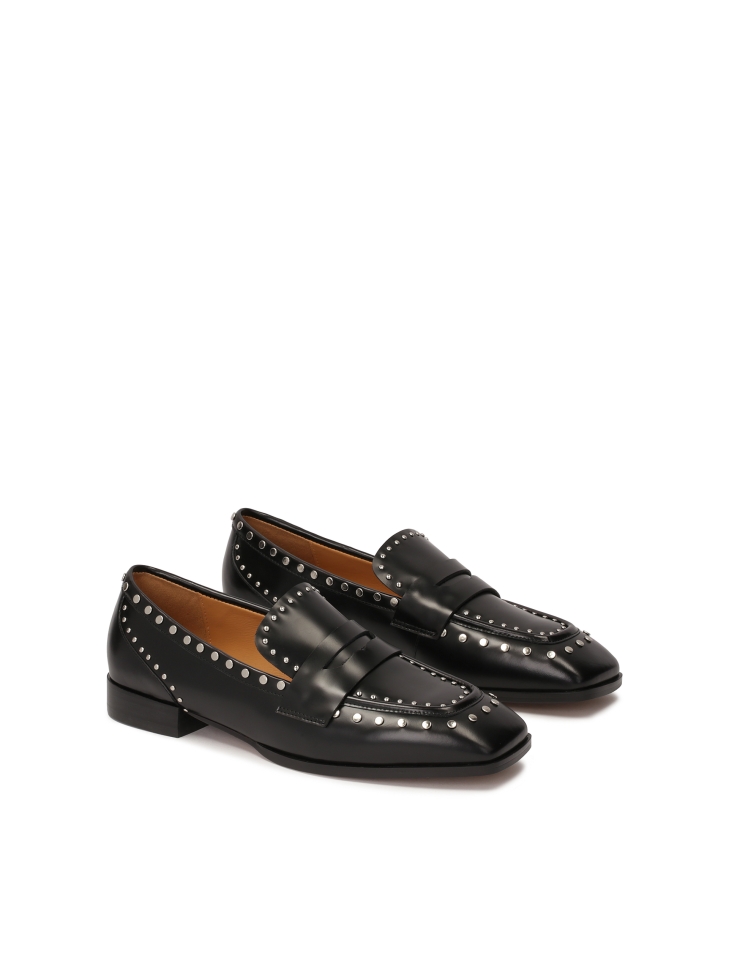 Black loafers with silver metal rivets
