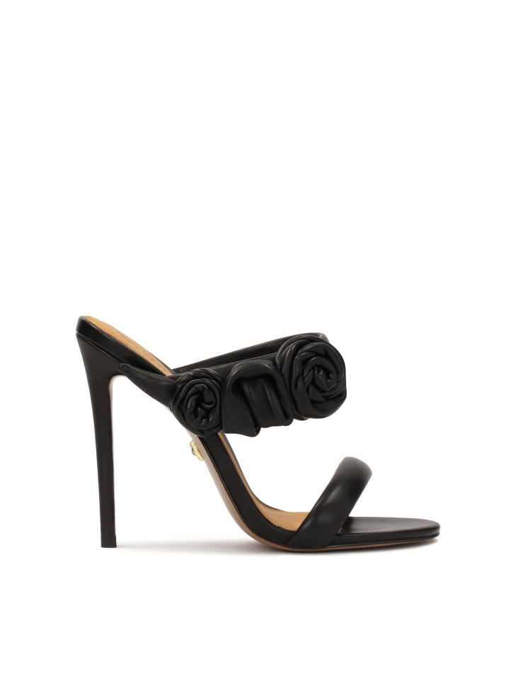 Elegant black mules with roses on a high stiletto heel