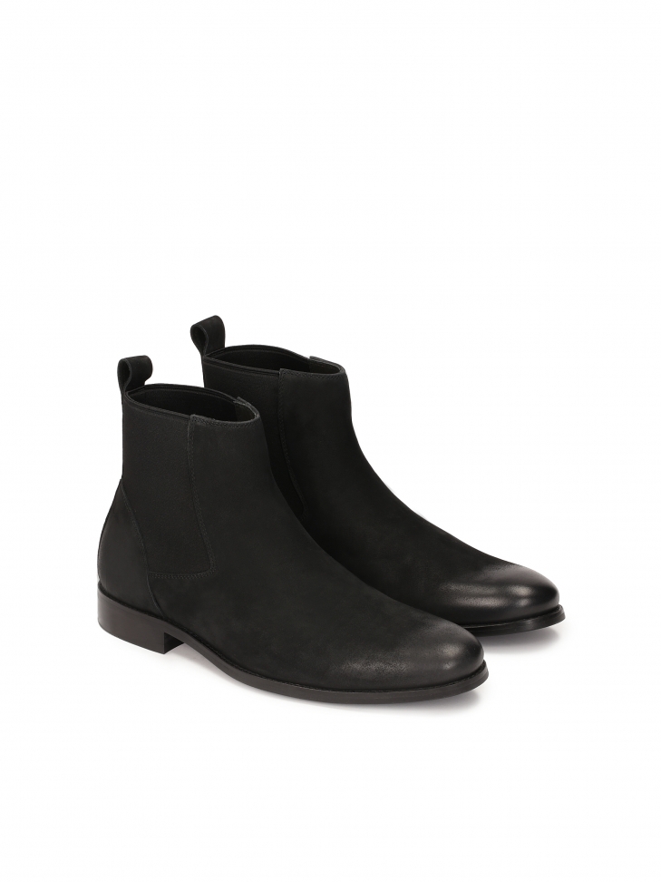 Slip-on black Chelsea boots with elastic inserts