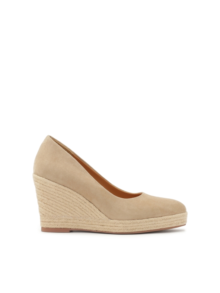 Beige suede pumps on a platform heel