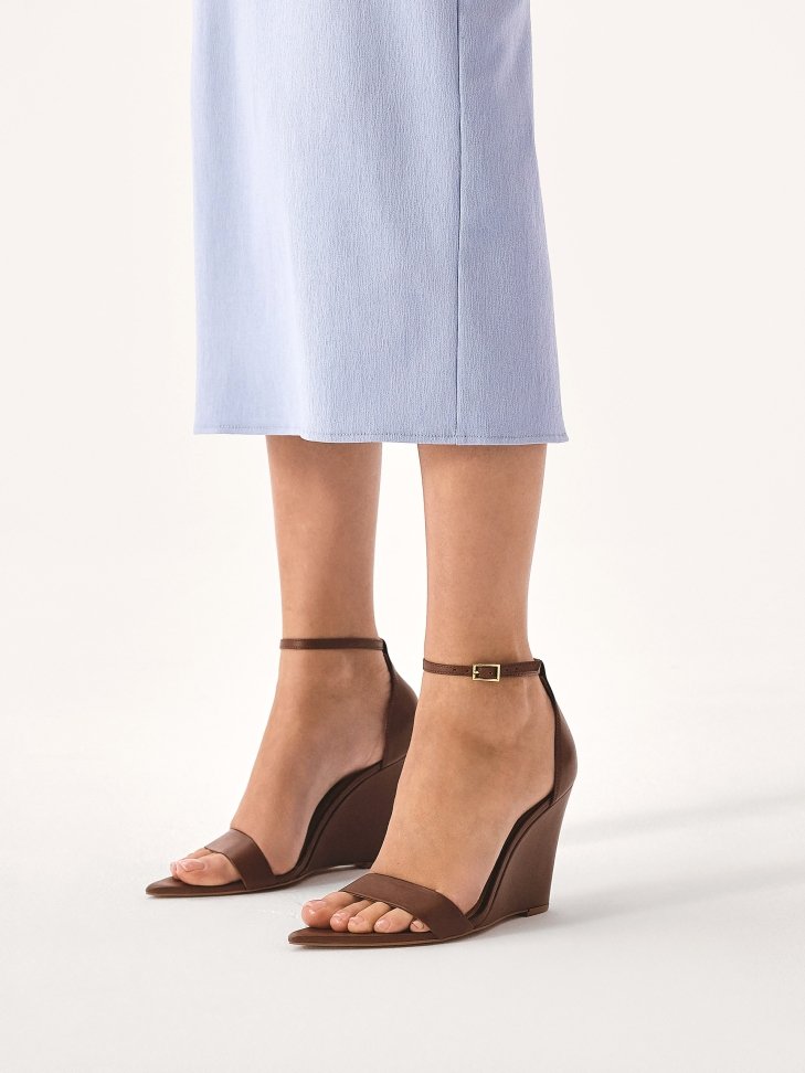 Brown leather sandals with a platform heel