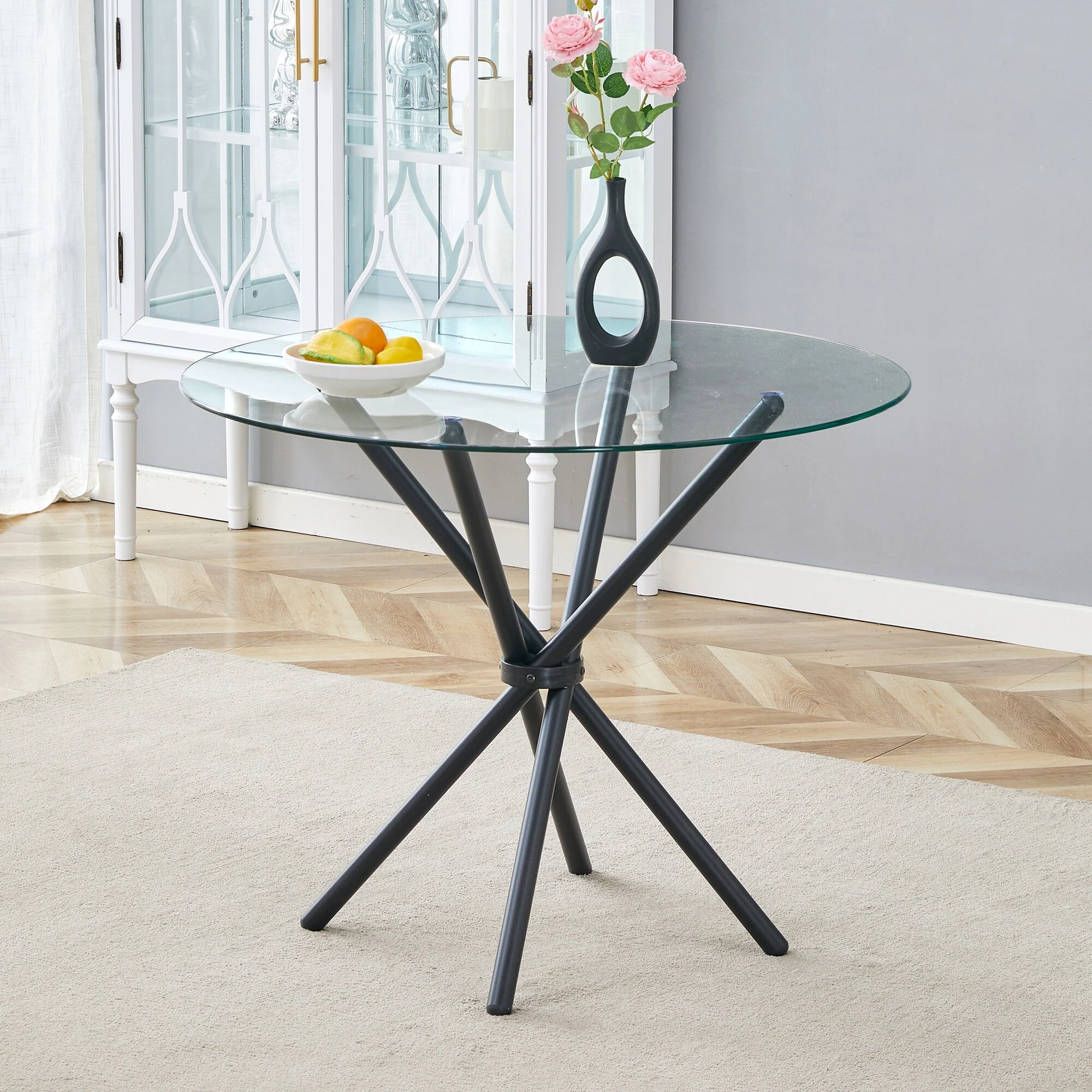 A circular transparent tempered glass round table with a diameter of 36.6 inches, with ring-shaped gathered metal legs