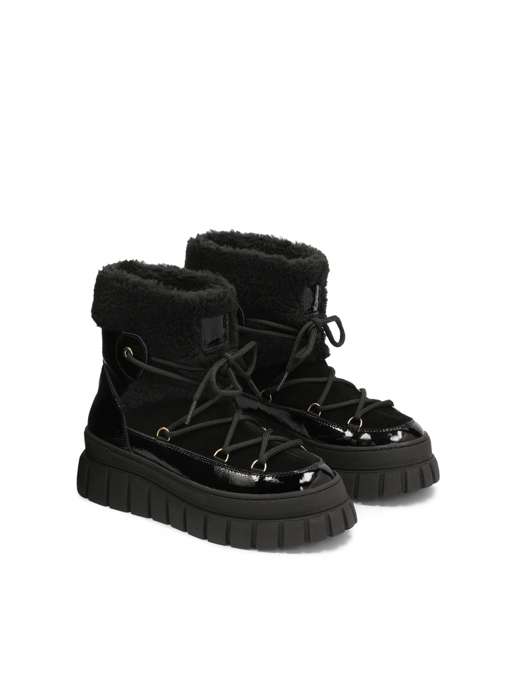 Insulated black snow boots made of combined materials
