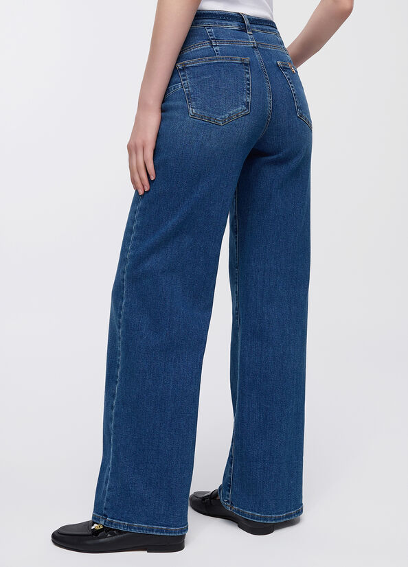Jeans flare cropped con cintura