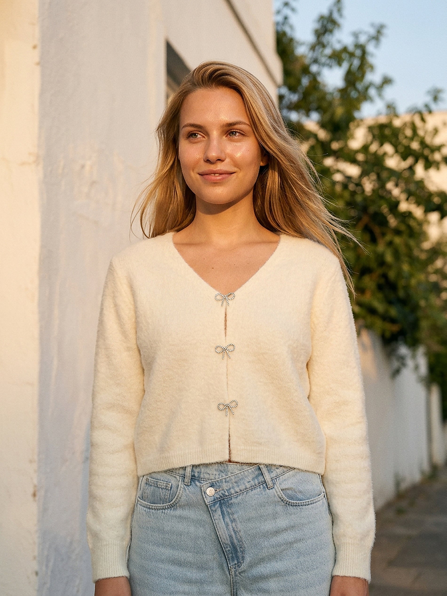 Sweter z kokardami