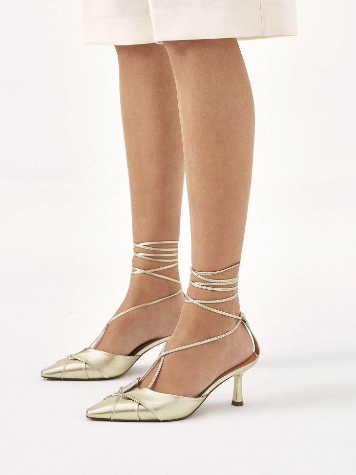 Open heel pumps in gold color