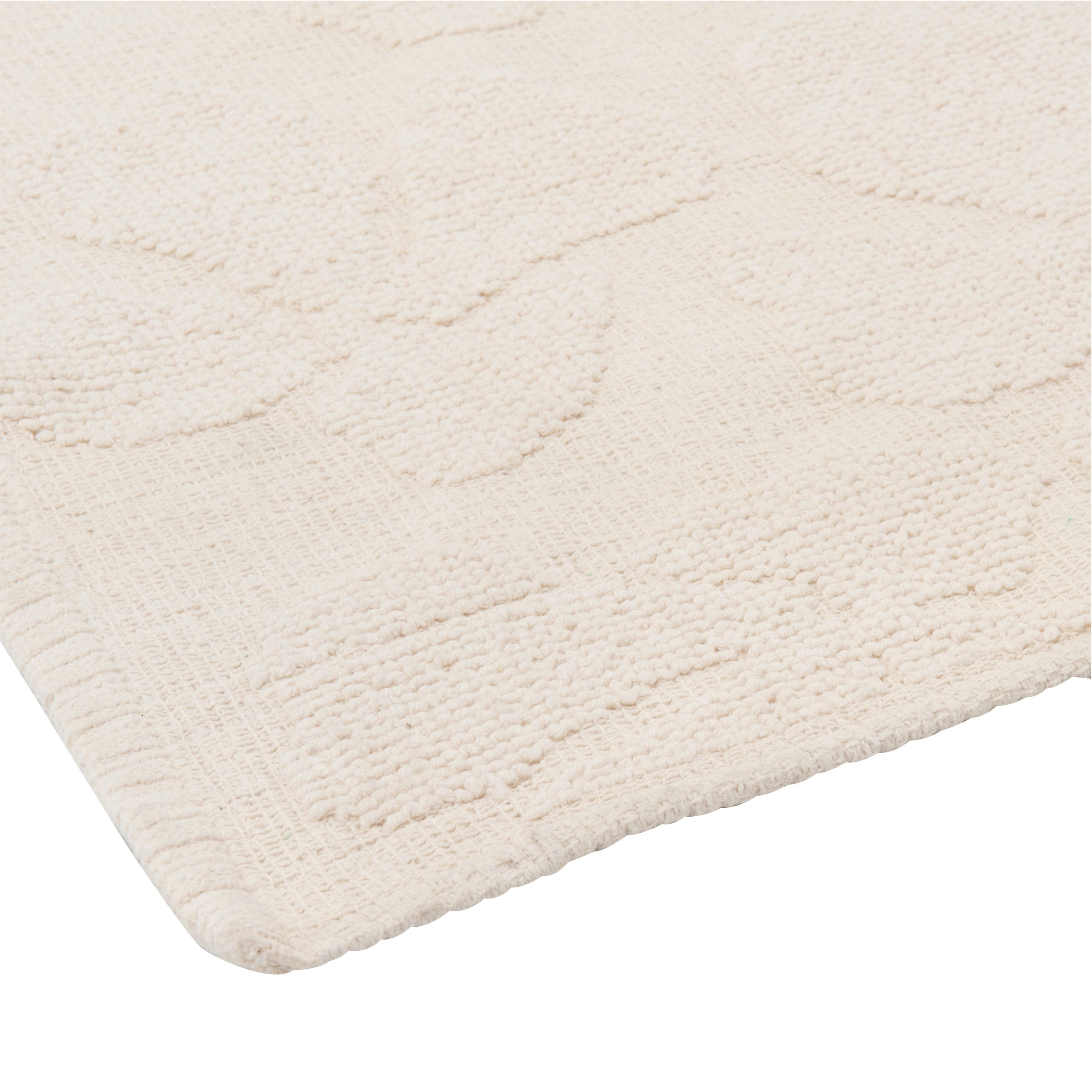 OUSTAU - Tapis tissé jacquard en coton recyclé motif floral en relief blanc 60x120