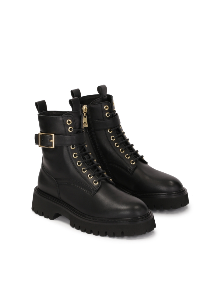 Black boots on a treaded sole