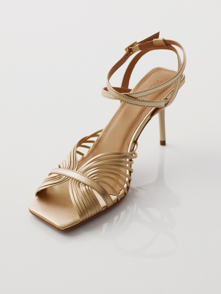 Gold sandals with fine straps