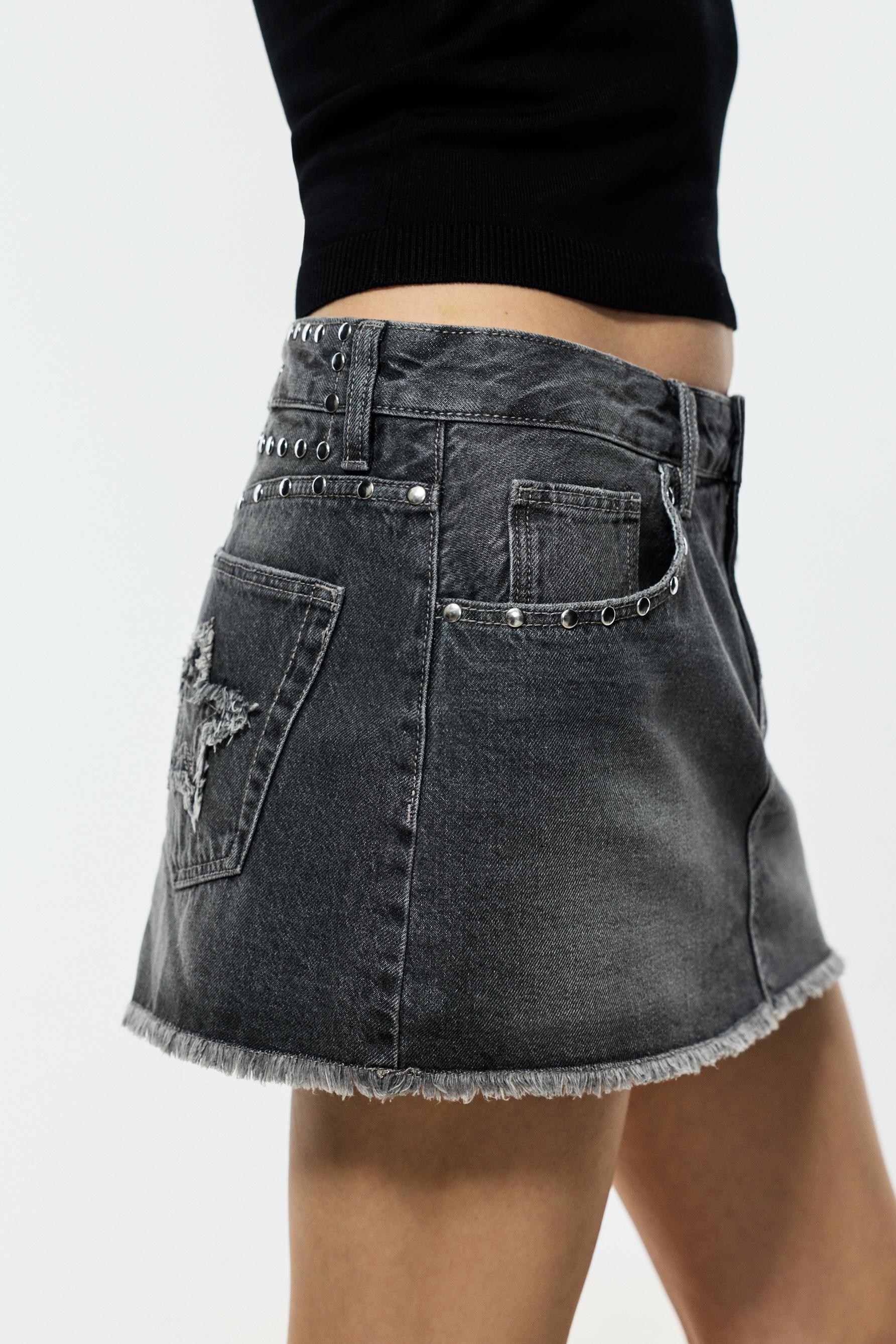 Falda denim tachas