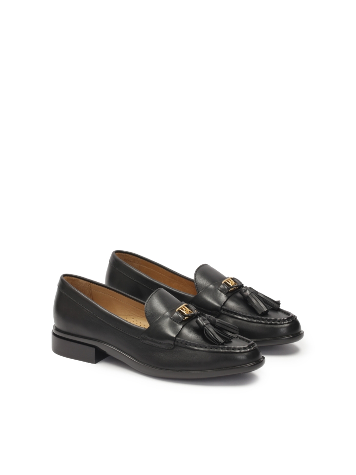 Leather shoes on a flat sole decorated with hooks