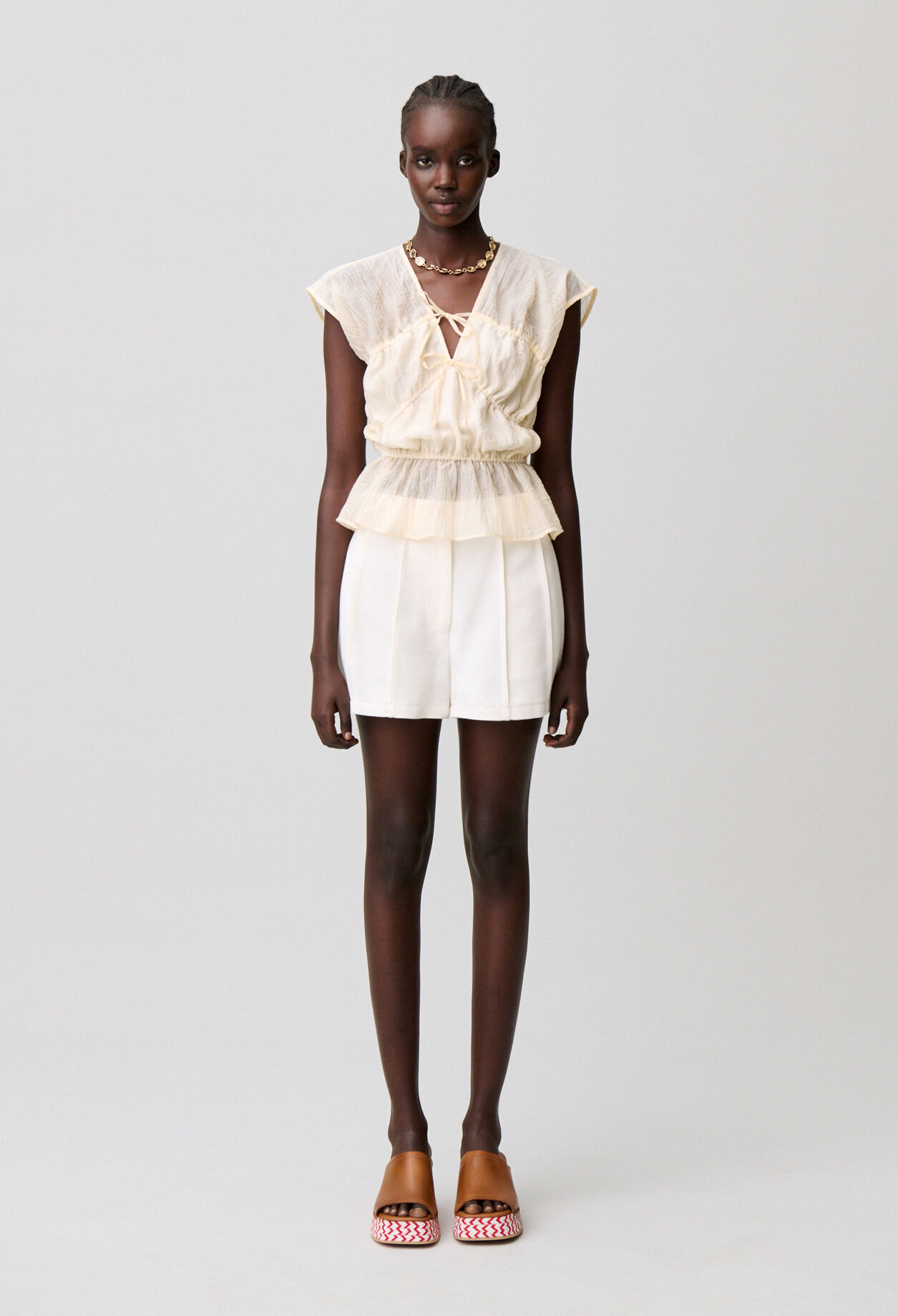 Short surpiqué couture