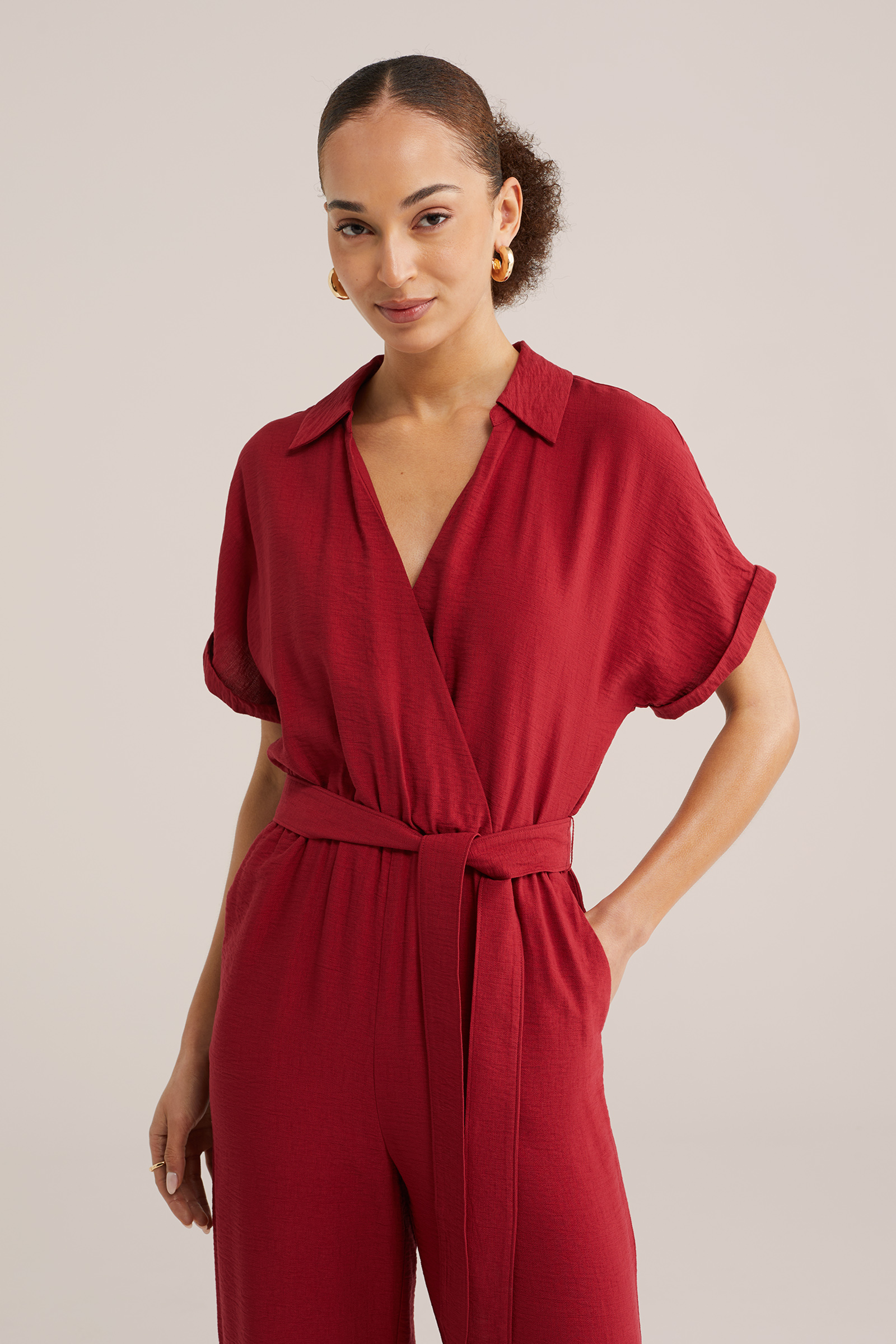 Dames jumpsuit met strikceintuur