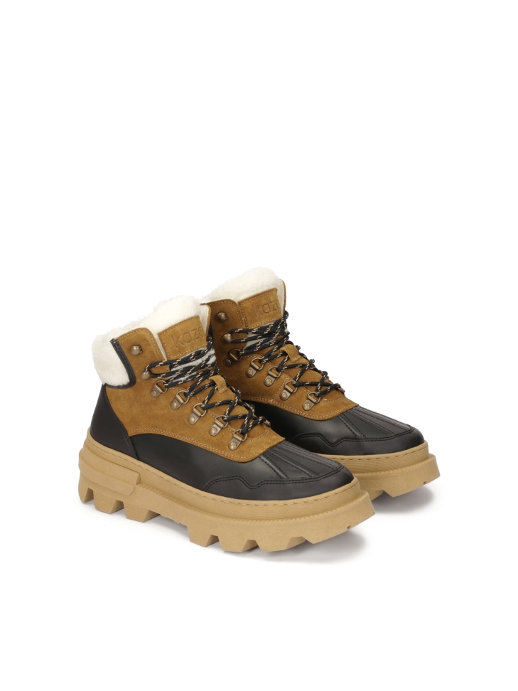 Brown and black boots inspired by snow boots with thick soles