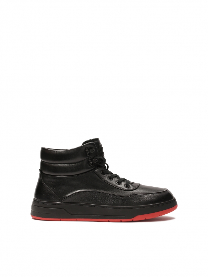 Black sneakers with contrasting red sole