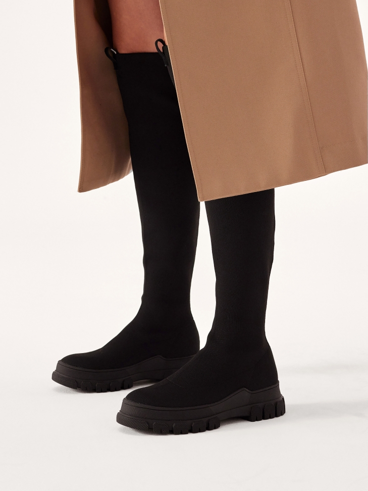 Flexible over the knee boots on a straight sole