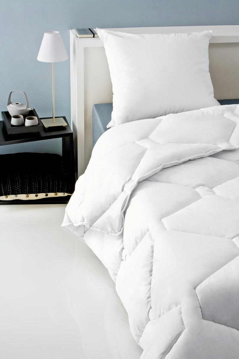 DOUCEUR - Oreiller 60 x 60 cm polyester ferme blanc 700g