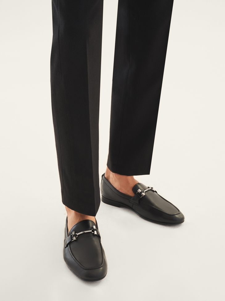 Men’s black leather loafers with a metal decoration
