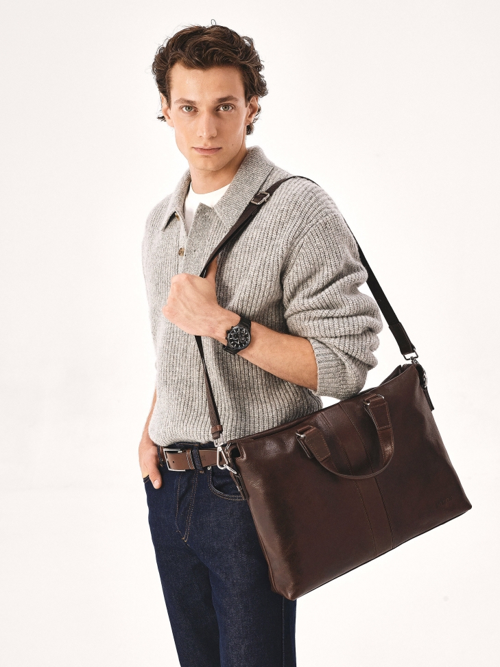 Brown leather bag with hand grips