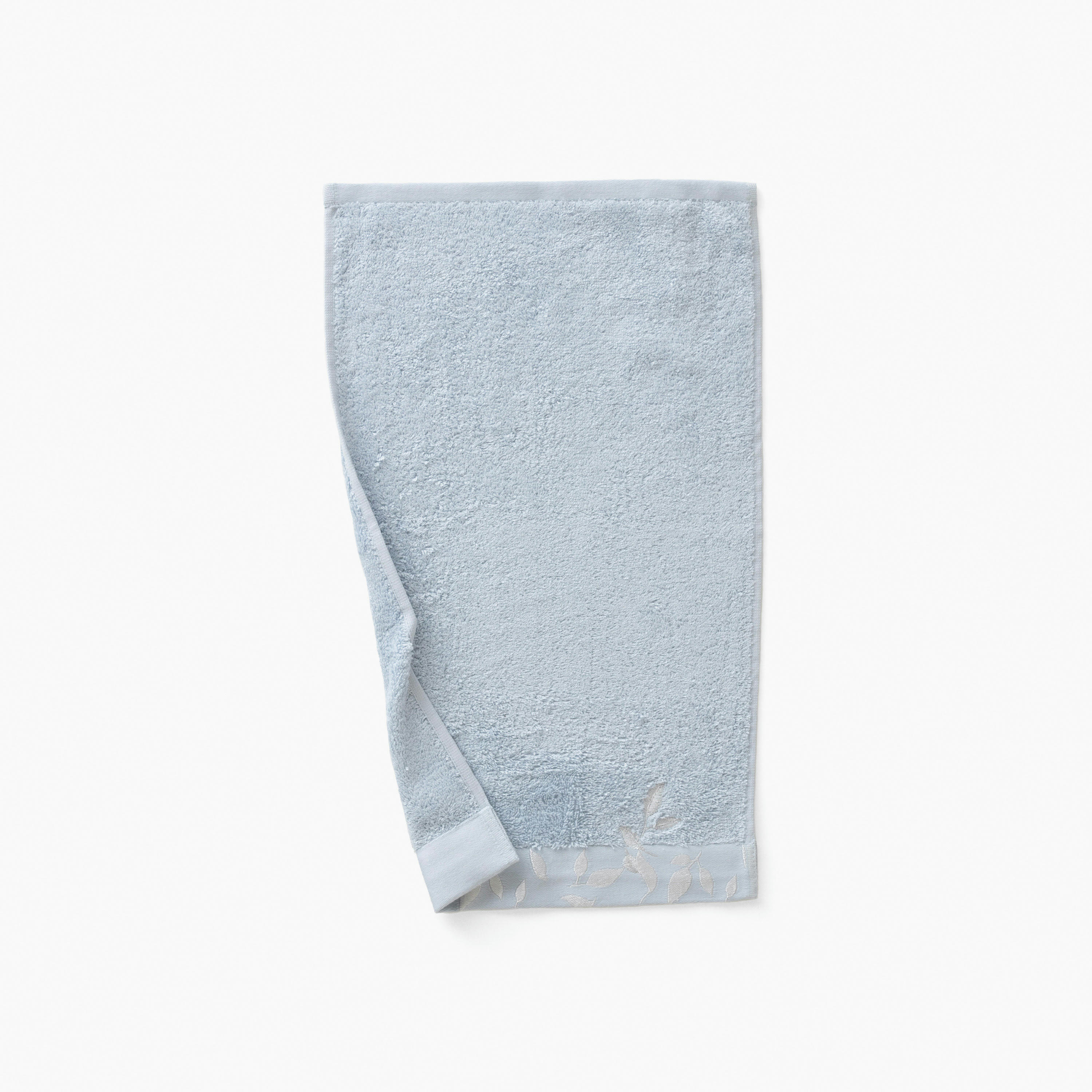 EQUINOXE - Serviette invité Bleu Givre brodé bouclette jacquard bleu 30x50