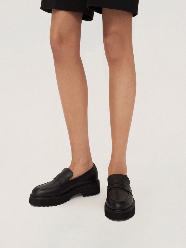 Slip on leather casual shoes on a thick sole