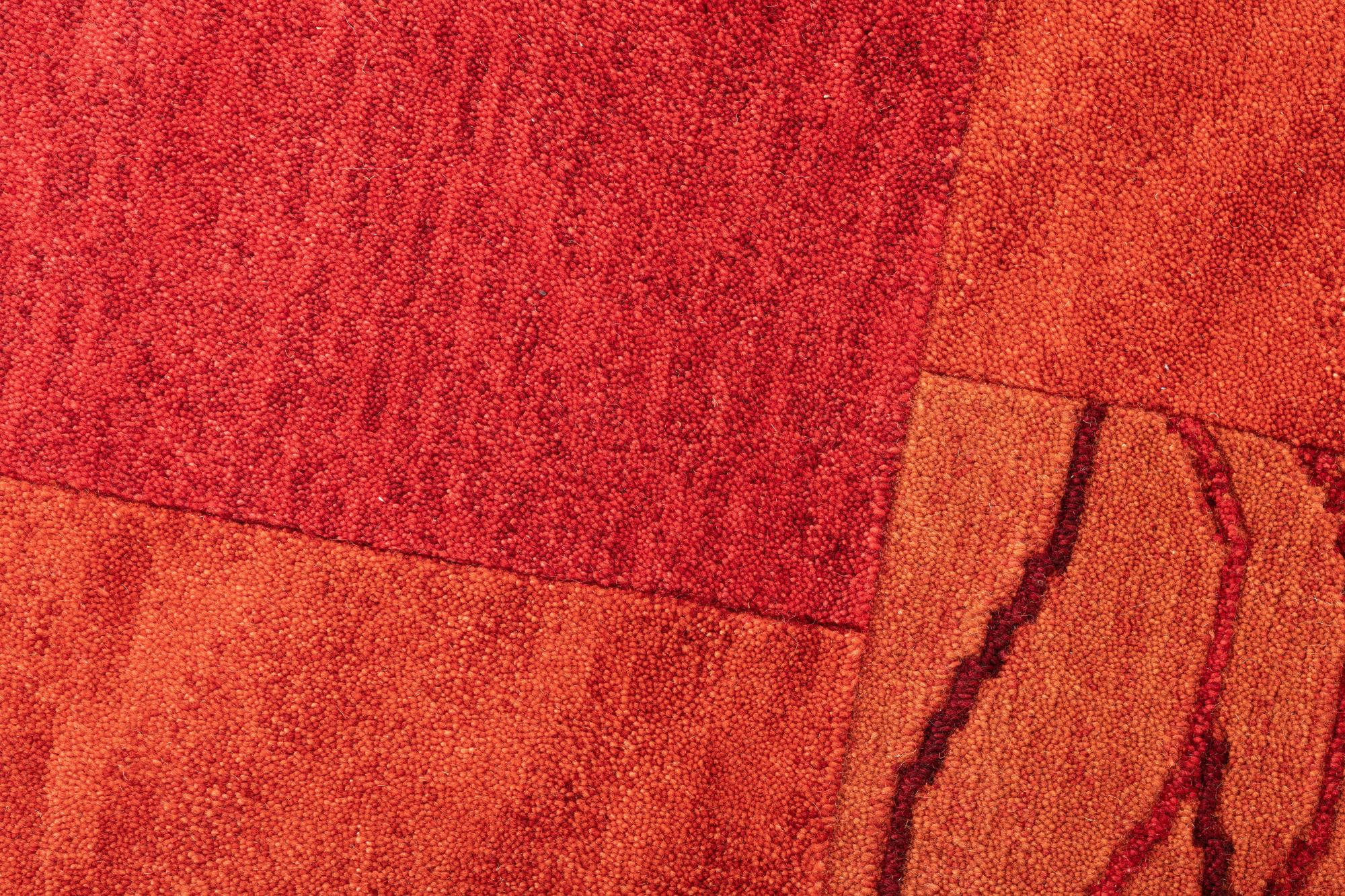 ROYAL DOMAS - Tapis tufté main en laine vierge - rouge 190x290 cm
