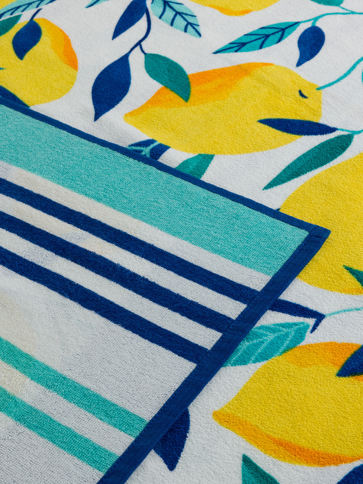 Telo mare in cotone stampa limoni