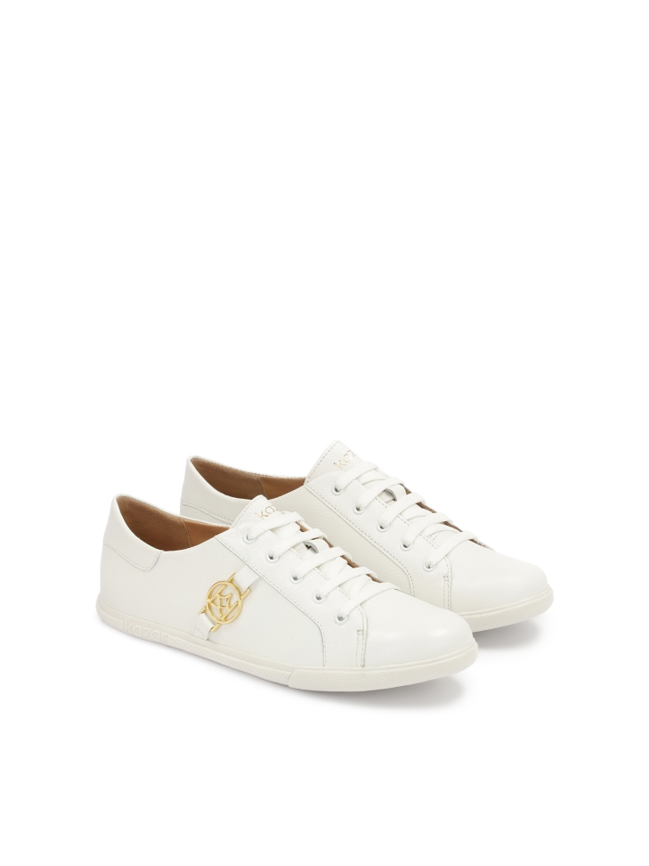 White leather sneakers decorated with a monogram