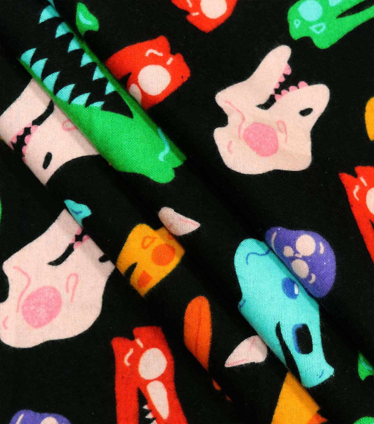 Multicolor Dinosouar Heads Super Snuggle Flannel Fabric by POP!