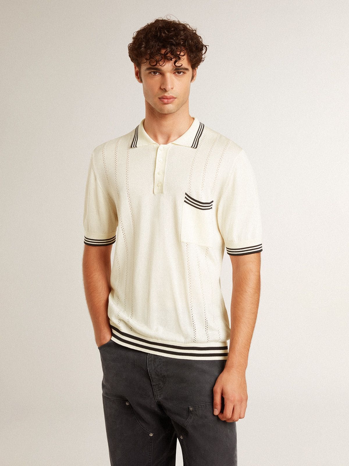 Men's worn-white knitted polo shirt with blue ribbing