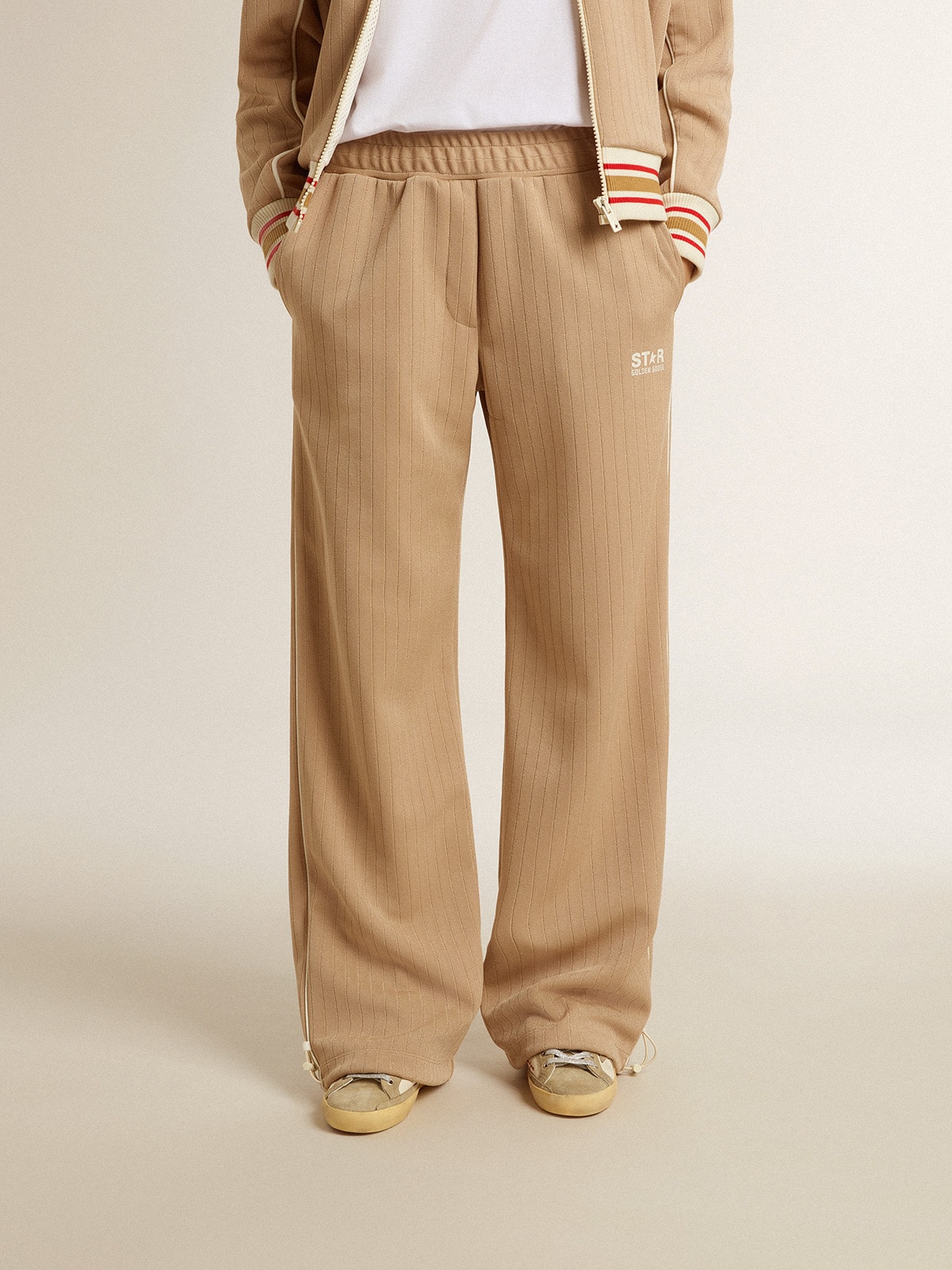 Women's light beige joggers with white logo