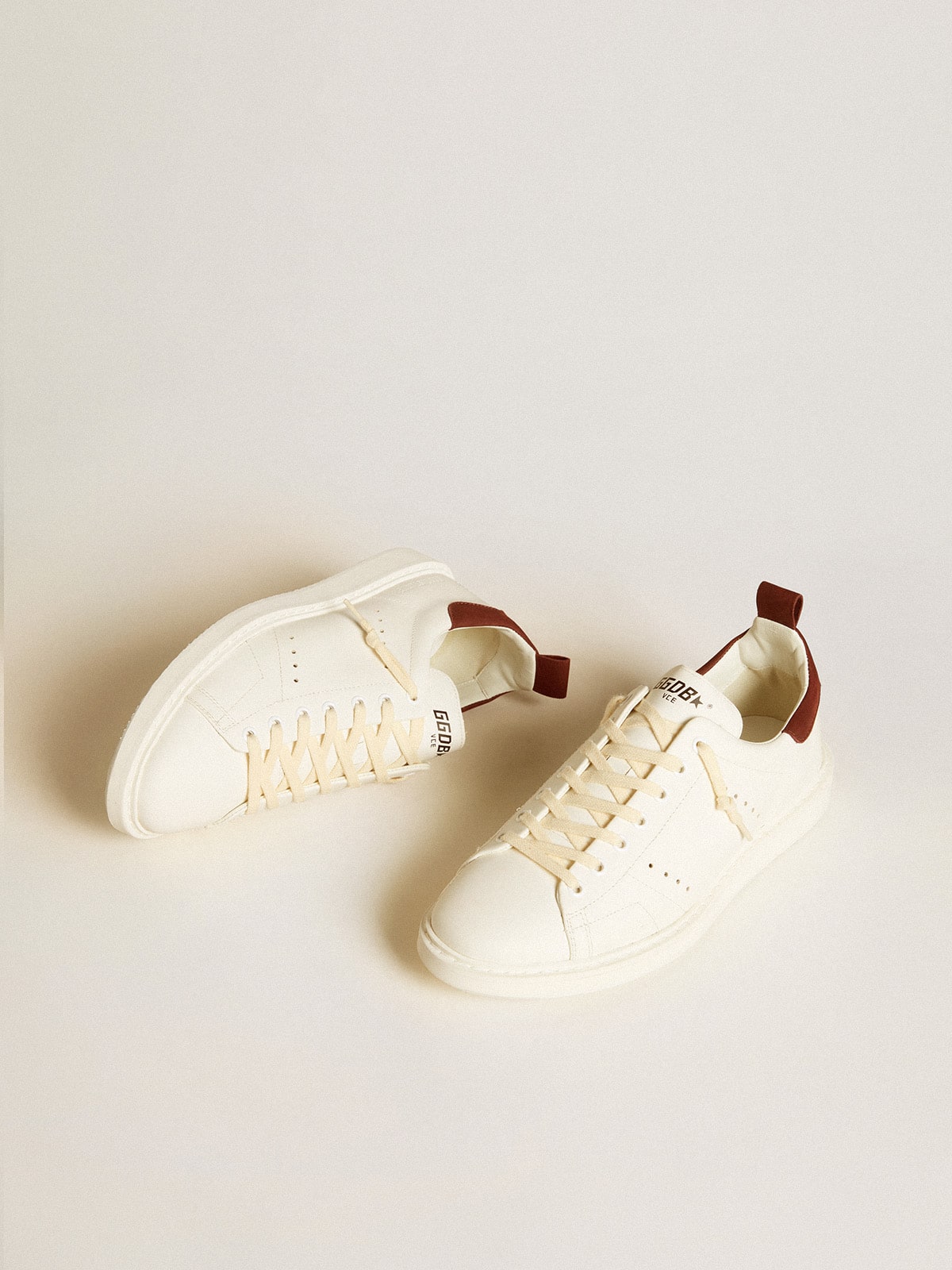 Men's Starter LTD in white leather with burgundy nubuck heel tab