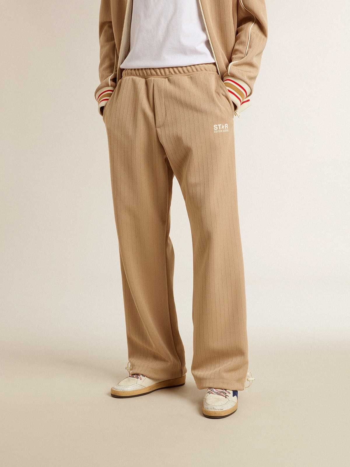 Men's light beige joggers with white logo