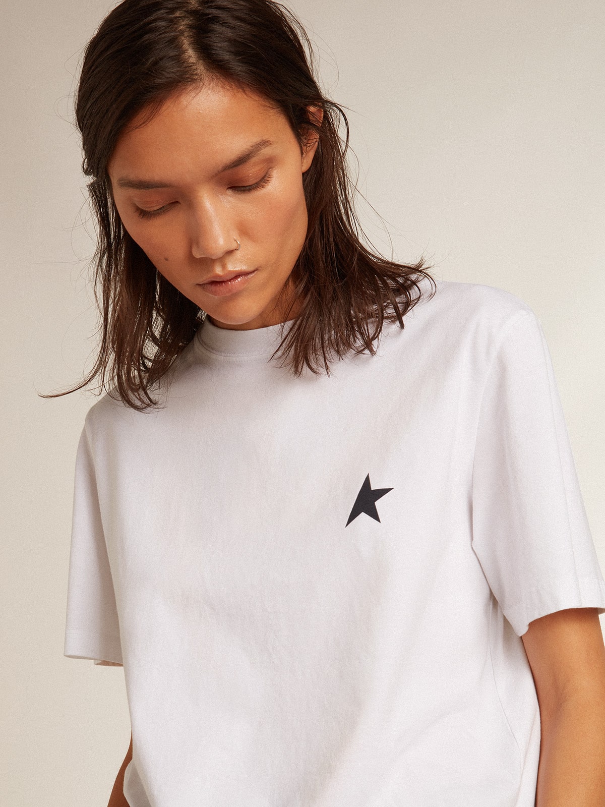 Women's white T-shirt with dark blue star on the front